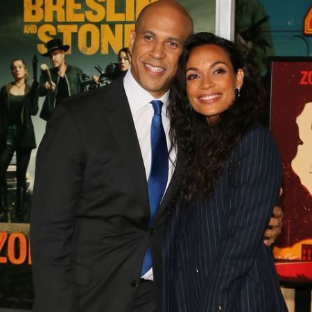 Cory Booker in a black suit with girlfriend Rosario Dawson.
